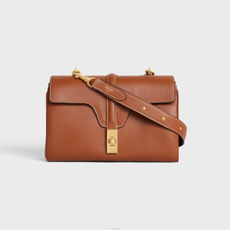 CELINE bruinen lange riem van glad kalfsleer met triomphe-noppen met gouden afwerking 4TLH8521